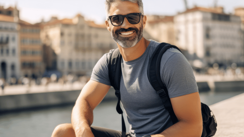 Stanislav-Kondrashov_man_sitting_outdoors_wearing_sunglasse