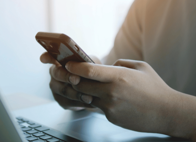 A man holding a smartphone in his hands